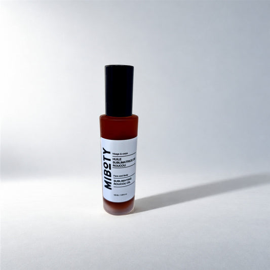 Huile Sublimatrice Roucou, photo en studio sur fond gris clair